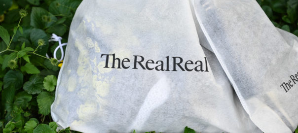 The RealReal shopping bag on leaves
